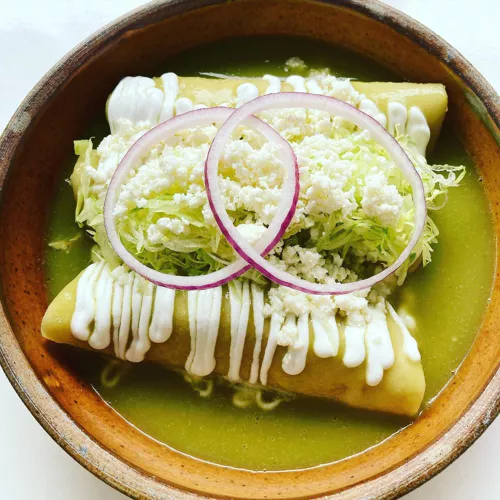 Casa Enrique signature dishes GuacamoleDe Pollo en Salsa Verde EnchiladasTacos de Carne AsadaDe Pollo con Mole de Piaxtla Enchiladas